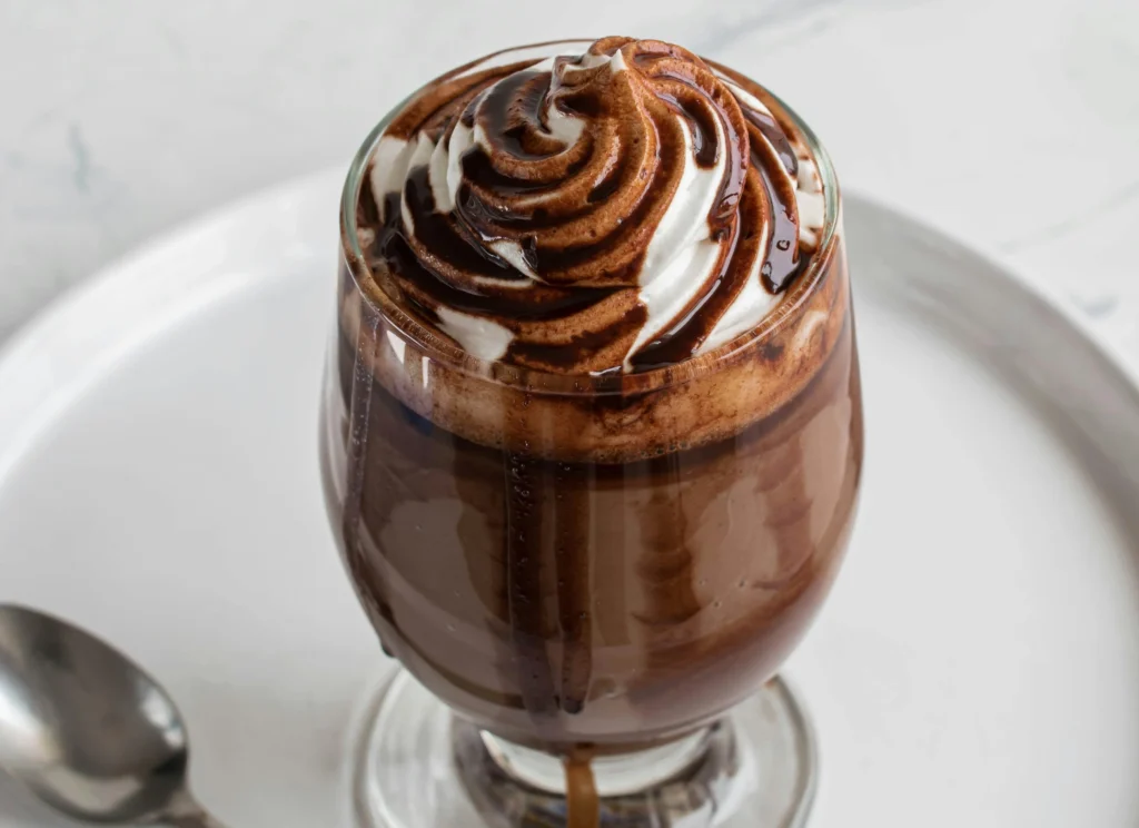 Close-up of a Chocolate Panna Cotta dessert garnished with chocolate shavings