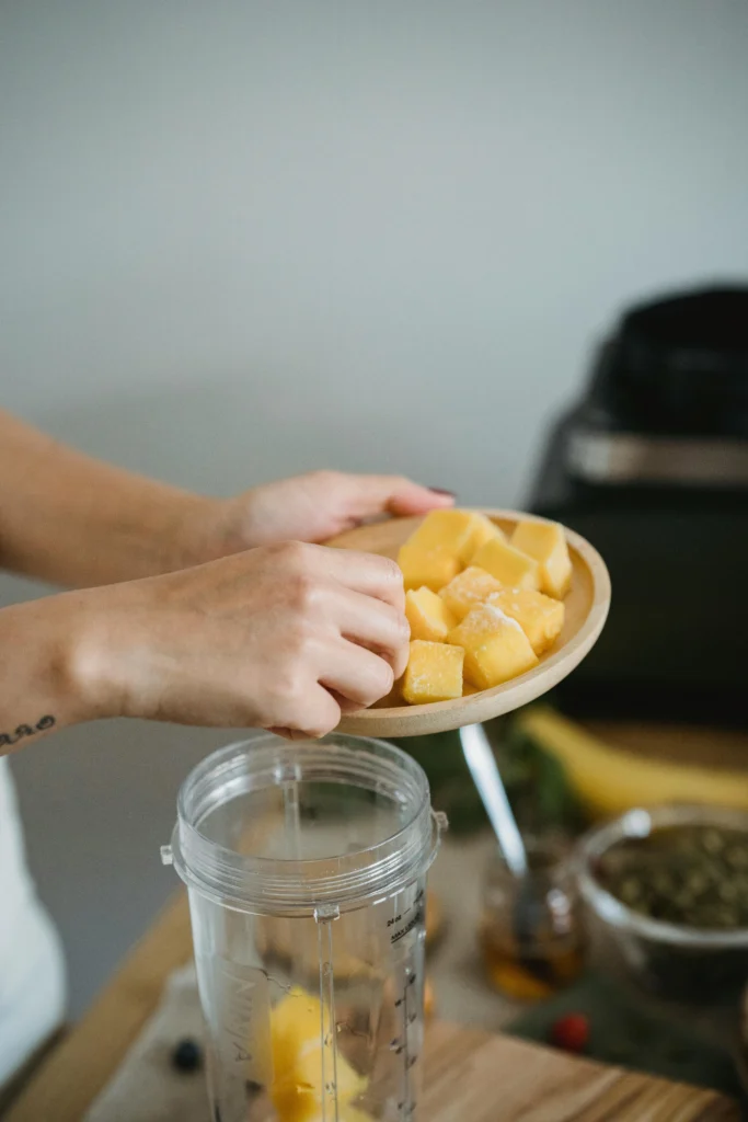 Mango Panna Cotta Person Holding Yellow Cubed Food