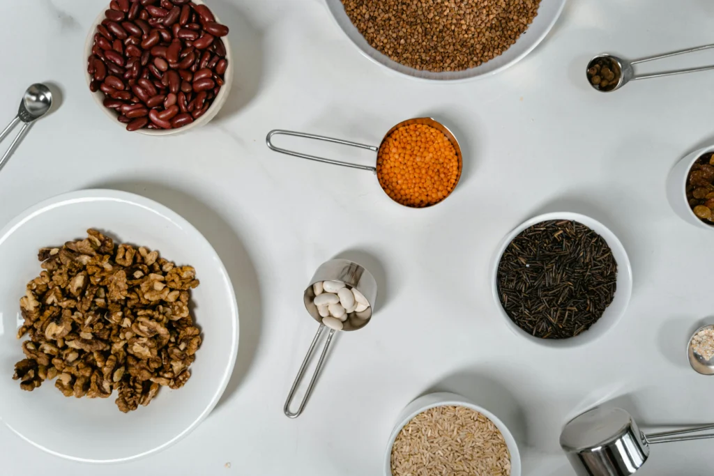 A collage of step-by-step images illustrating the cooking process of Chana Masala, from sautéing onions to simmering the dish to perfection.