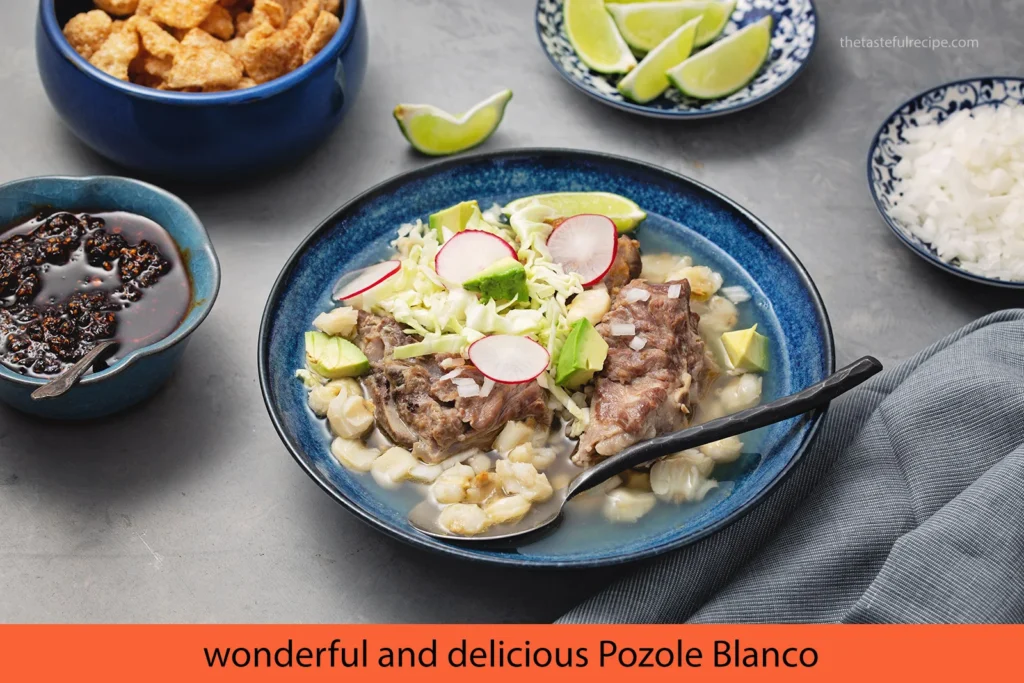 A festive table setting with bowls of pozole blanco and colorful napkins