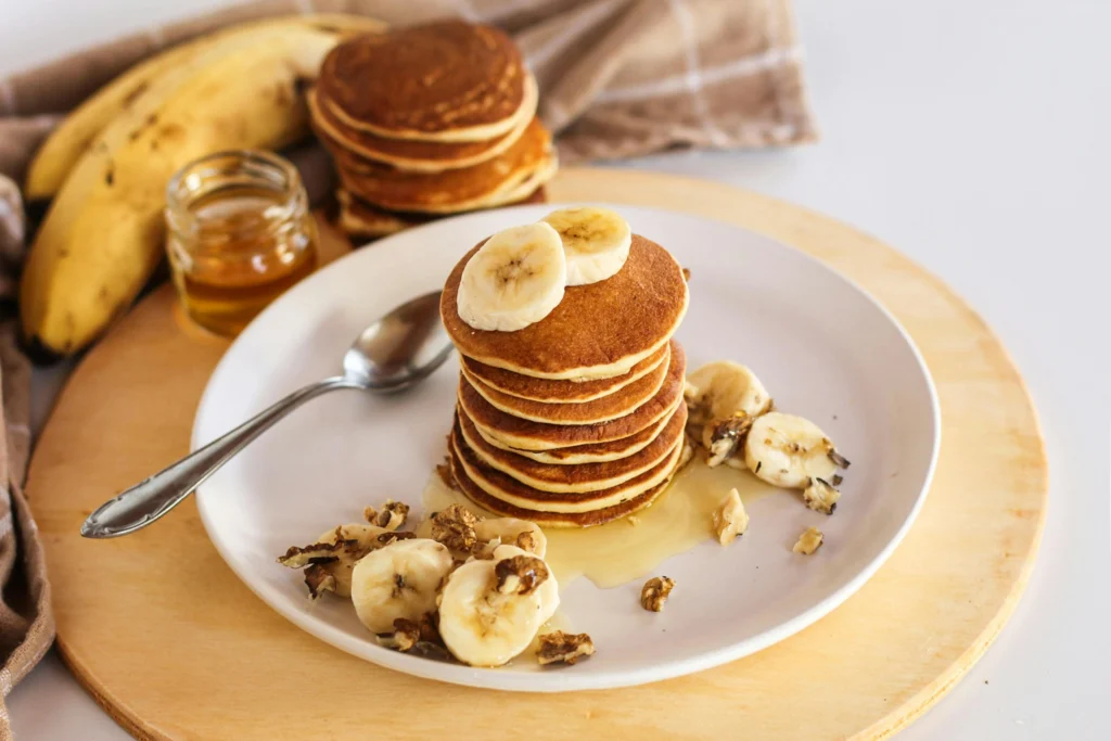 Close-Up Shot of a Stack of Fluffy Pancakes on a Plate