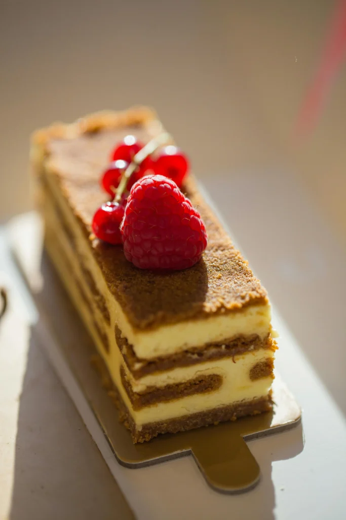 Close-up of a Slice of Tiramisu with a Raspberry on Top