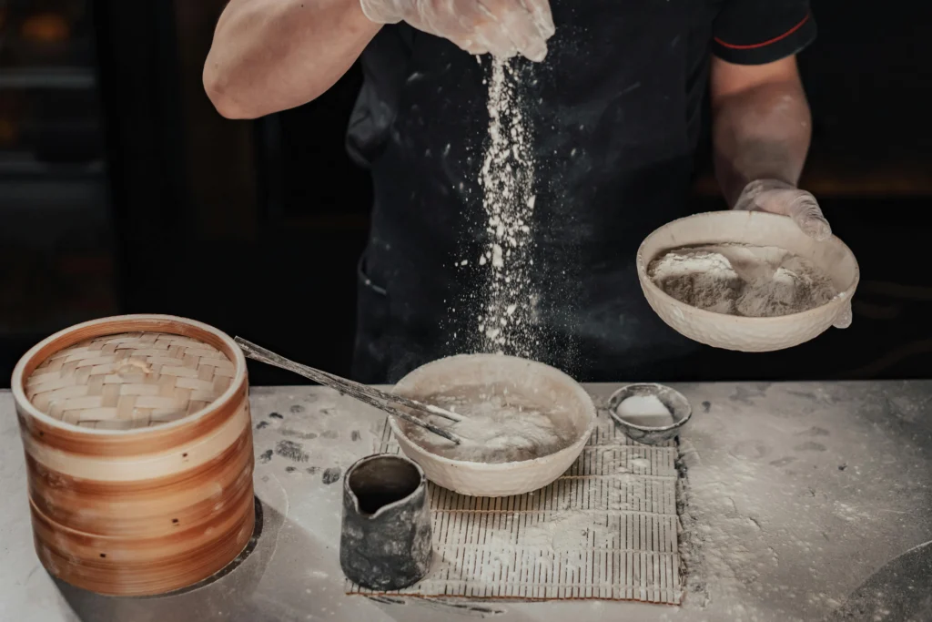 Man Preparing Dough in a Kitchen