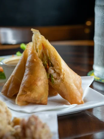 Platter of Philly Cheesesteak Egg Rolls: a crowd-pleasing appetizer option