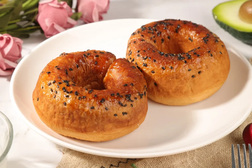 Golden-brown baked Utopia Bagels cooling on a wire rack