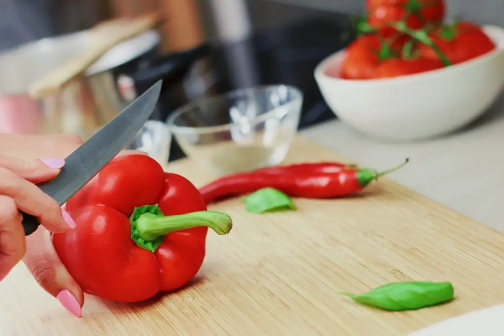 Fresh poblano peppers on a cutting board