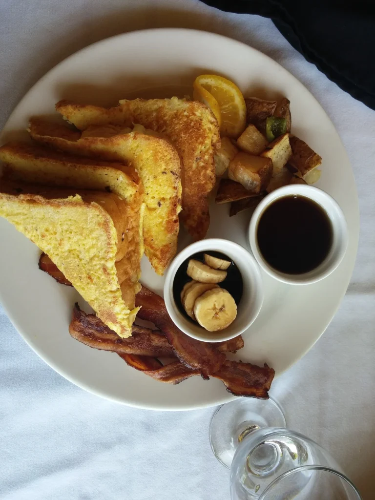 Image of a toaster with slices of bread ready to be toasted for French toast