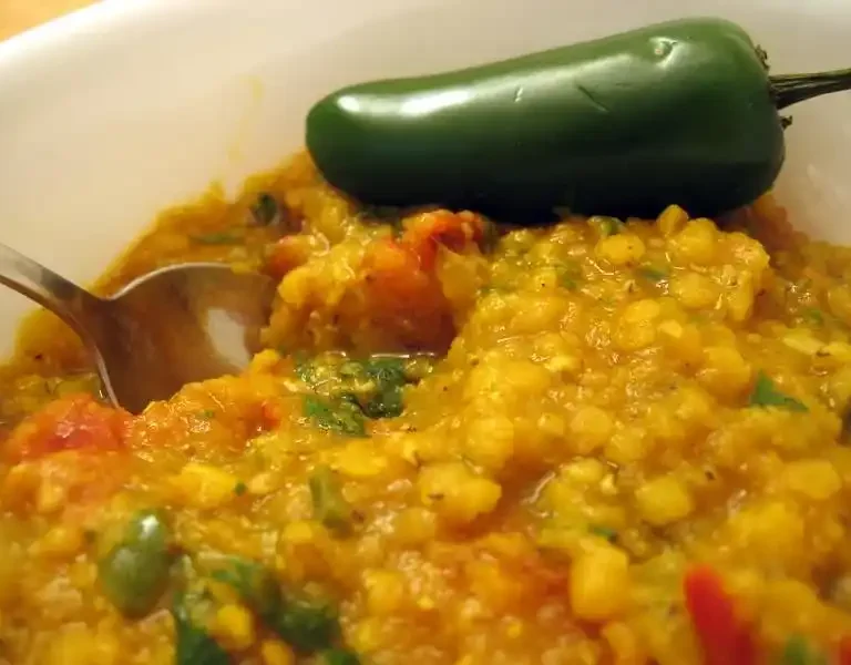 Masoor Dal being cooked in a pressure cooker, showing a quick and convenient cooking method