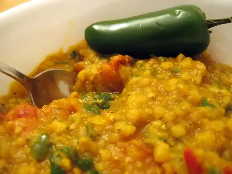 Masoor Dal being cooked in a pressure cooker, showing a quick and convenient cooking method