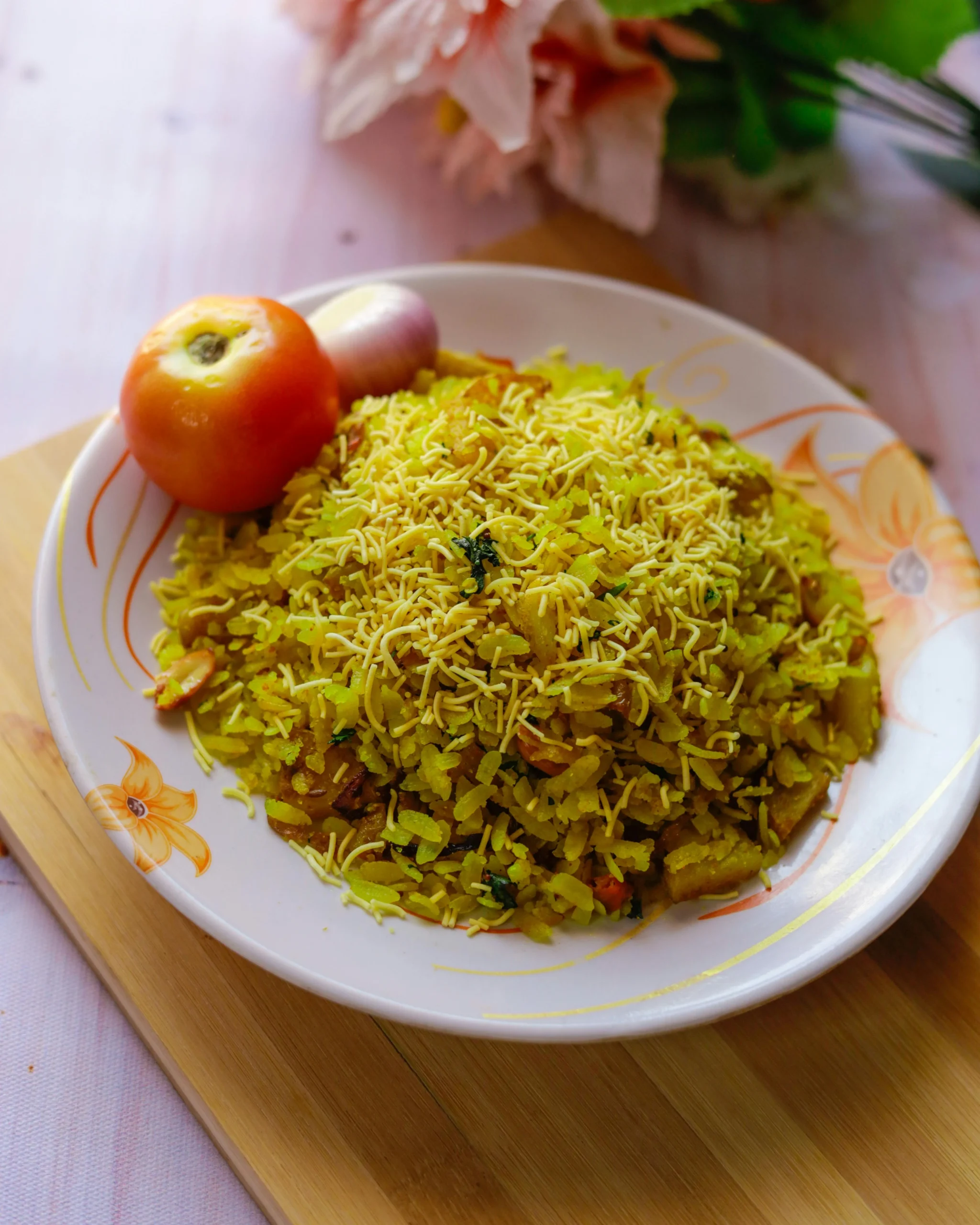 A Dish with Mexican Rice Served on a Plate with Floral Pattern