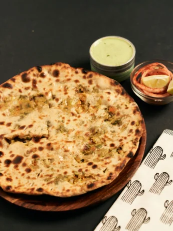 aloo paratha with Cheese on Wooden Plate_11zon