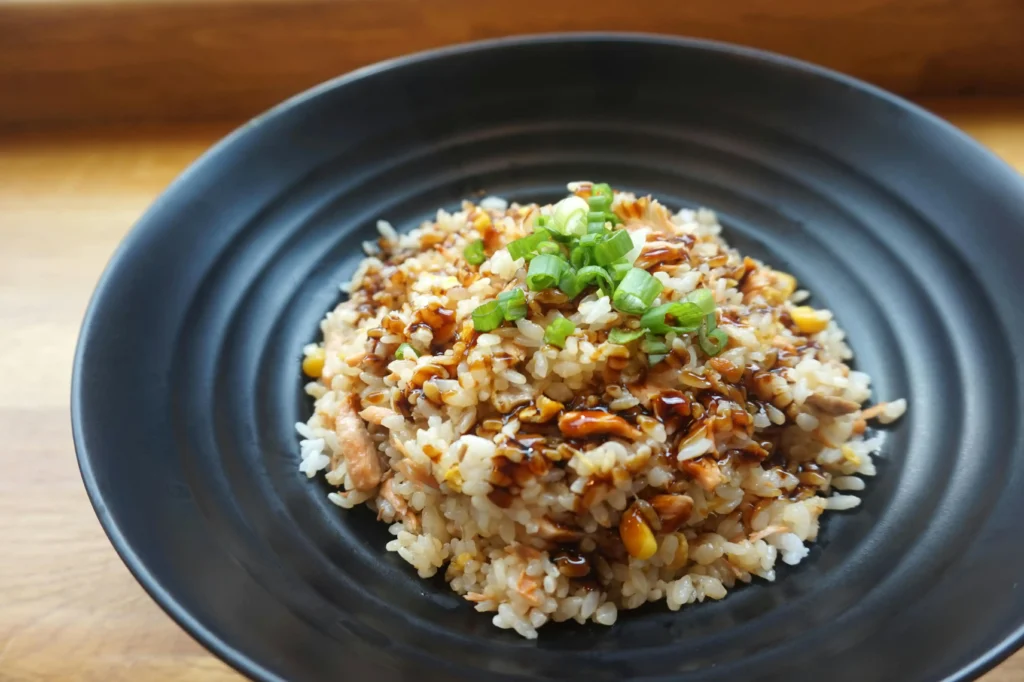 vegetable pulao on Black Ceramic Plate