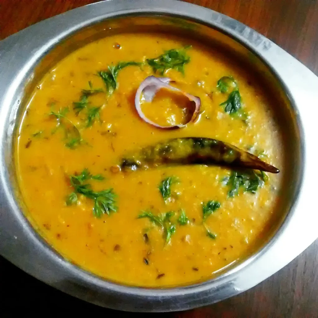 A bowl of freshly prepared Dal Tadka garnished with coriander leaves