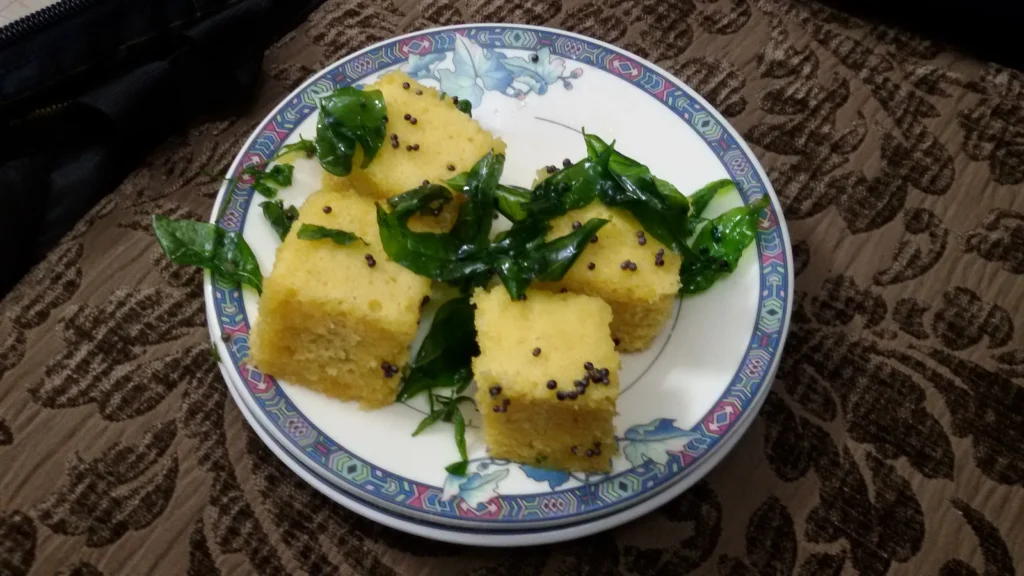 Close-up shot of a soft and spongy piece of Dhokla