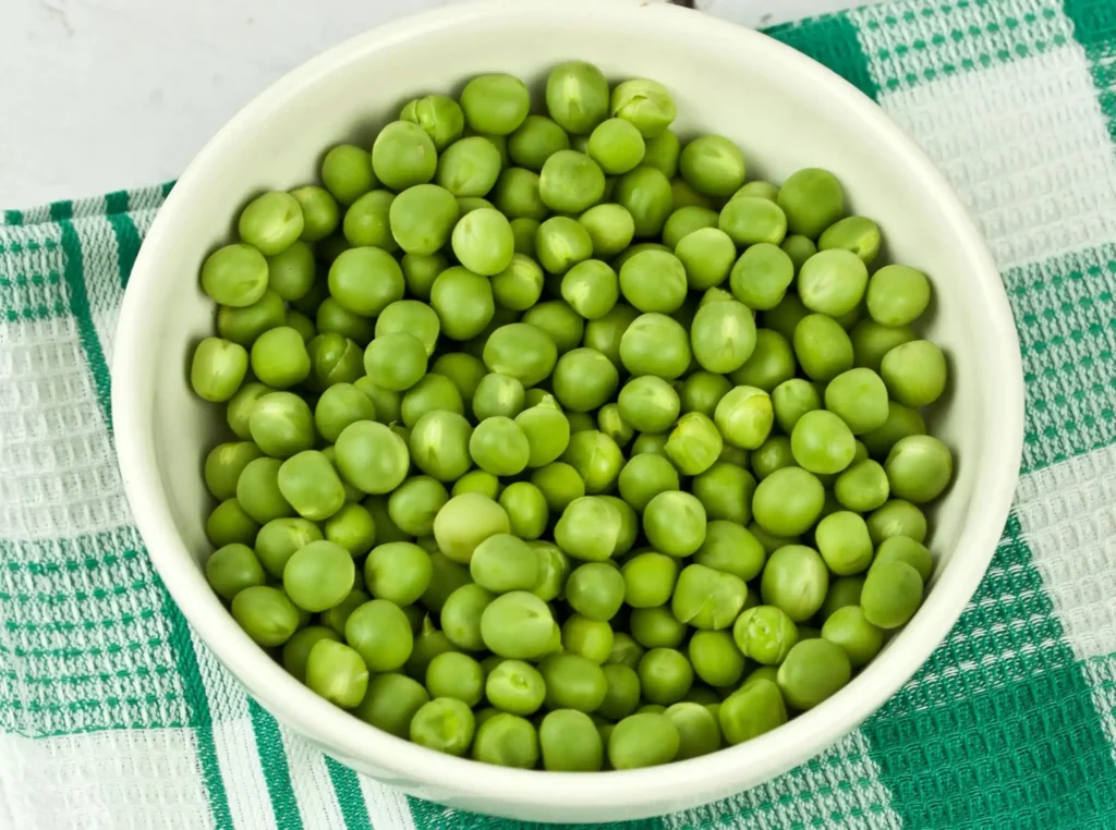 Green Peas On White Ceramic Bowl