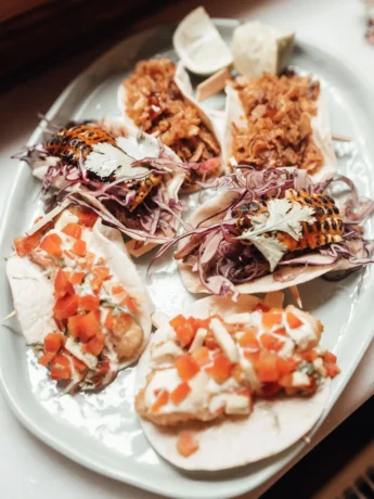 tinga de pollo with different ingredients on plate on windowsill in apartment_11zon