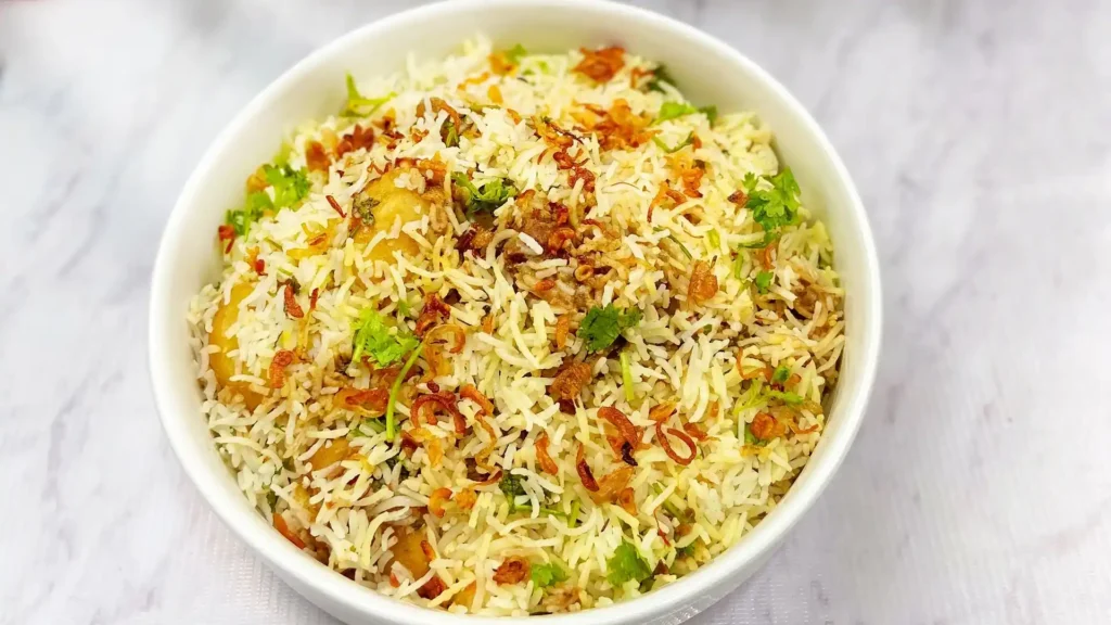 Festive table setting with a bowl of Vegetable Pulao as the centerpiece, ready to serve