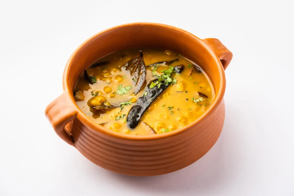 Masoor Dal served with steamed white rice and naan bread on a plate, ready to eat