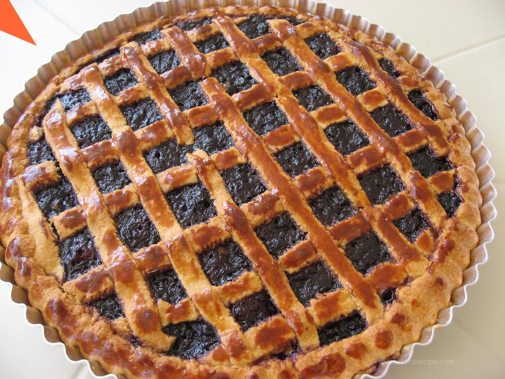 A freshly baked Crostata cooling on a wire rack, ready to be served