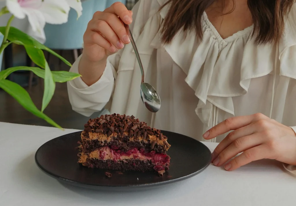 Beautiful Woman Eating Torta Caprese Cake