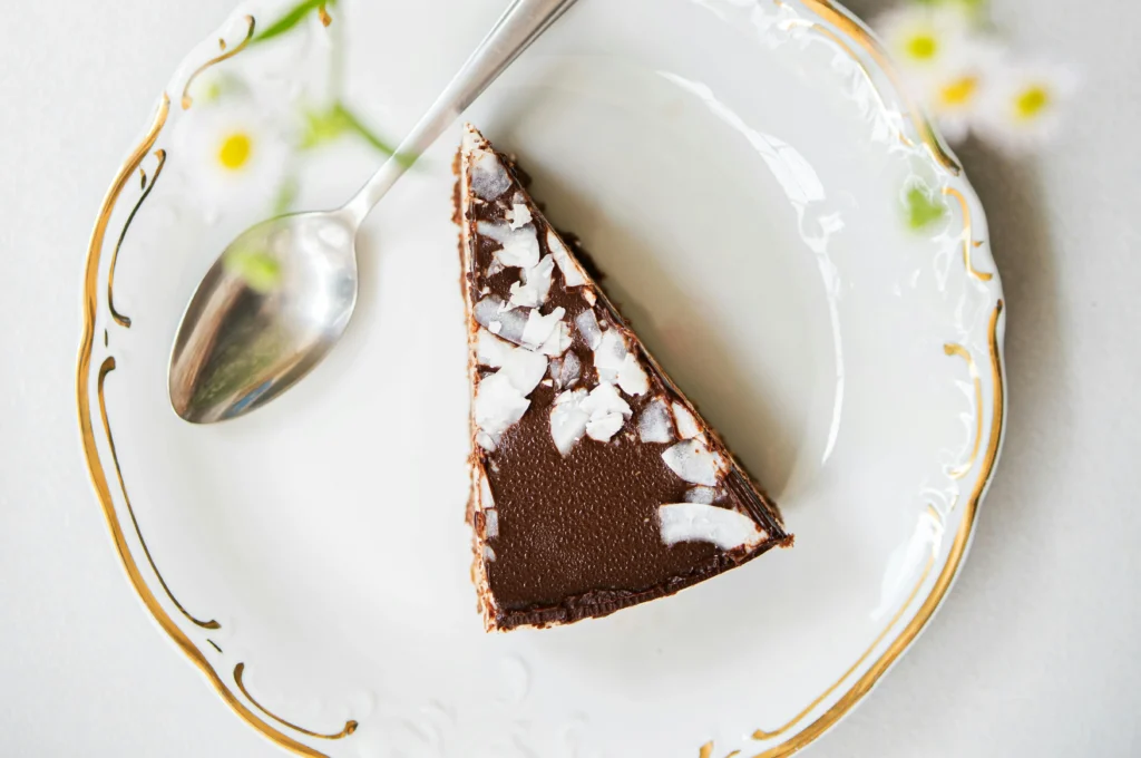 Photo Of Sliced Torta Caprese Cake On Ceramic Plate With Spoon