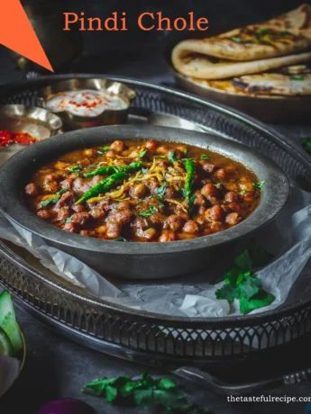 Pindi Chole served with naan bread, garnished with coriander leaves