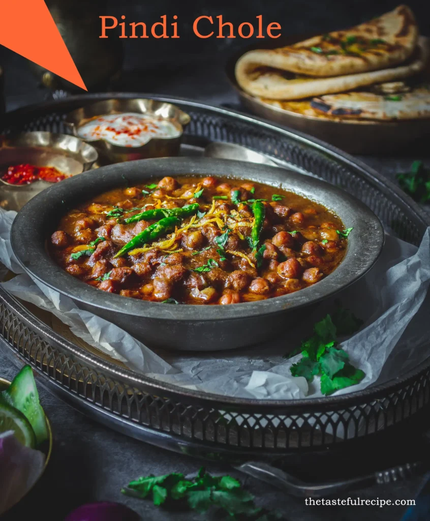 Pindi Chole served with naan bread, garnished with coriander leaves