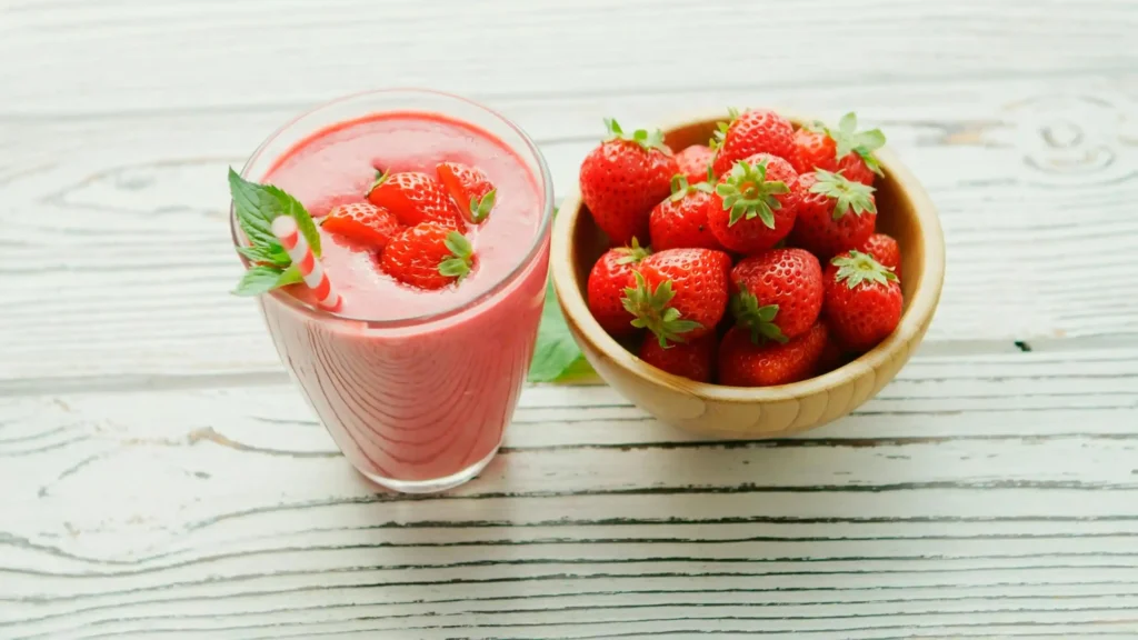 Close-up of a Strawberry Milkshake with whipped cream and a cherry on top