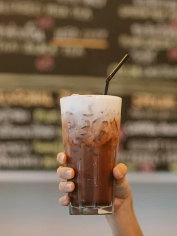 Refreshing glass of Cold Brew Coffee with ice and a straw