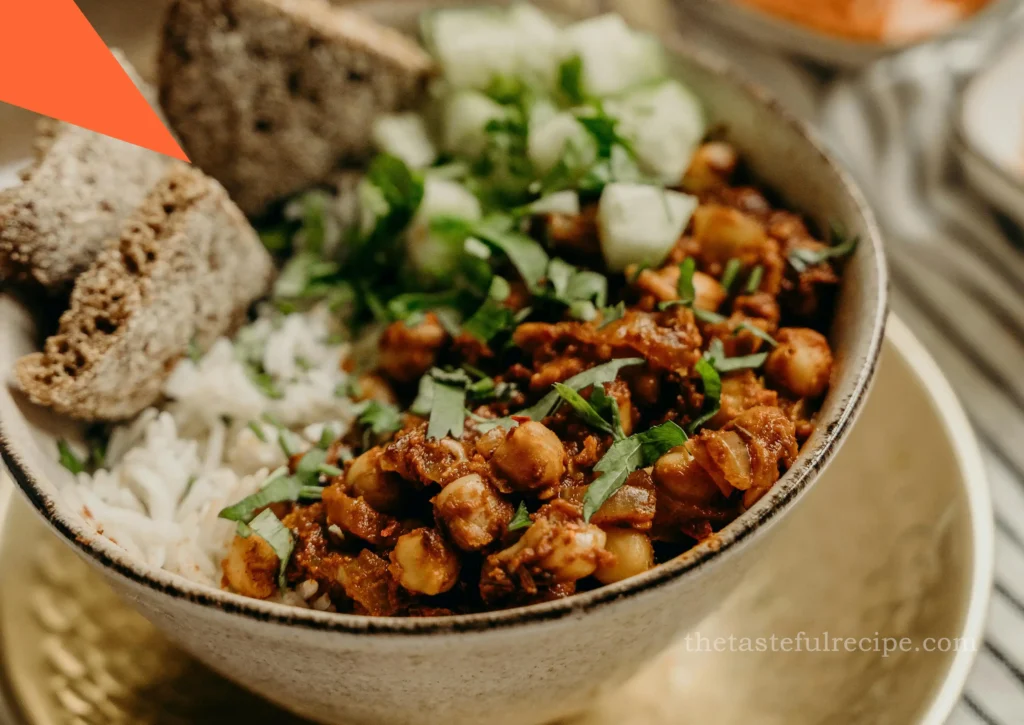 A spoonful of Pindi Chole showing the rich, spicy chickpea curry