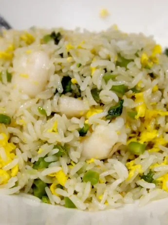 Shrimp Fried Rice topped with sesame seeds and served in a bowl