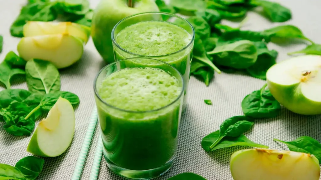 Green smoothie in a mason jar with a measuring tape, symbolizing weight loss benefits