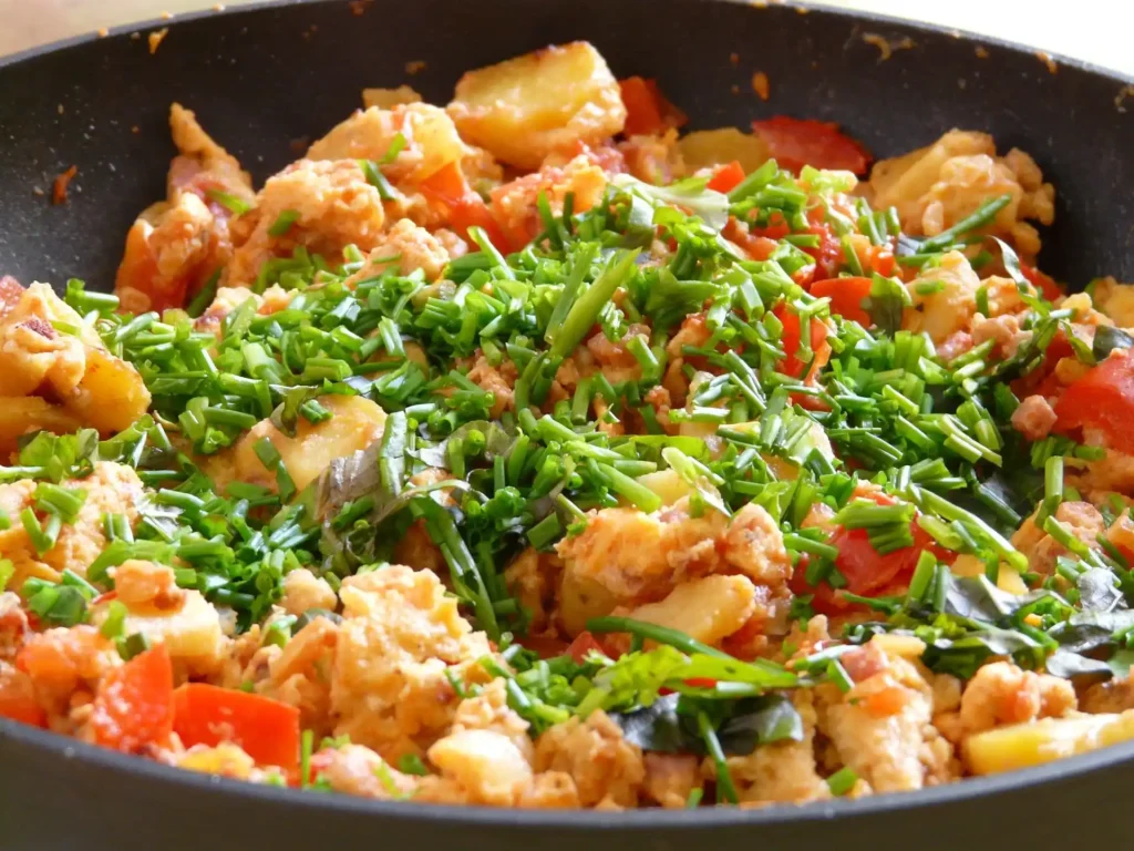 A close-up view of the vibrant colors of Chinese cabbage stir fry in the skillet