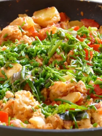 A close-up view of the vibrant colors of Chinese cabbage stir fry in the skillet