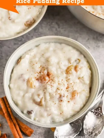 A serving of rice pudding on a plate with fresh fruit on the side for a delicious combination