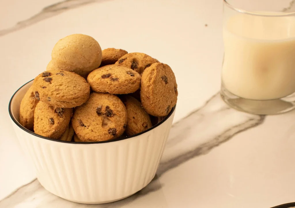 3 ingredient peanut butter cookies cooling on a wire rack fresh out of the oven