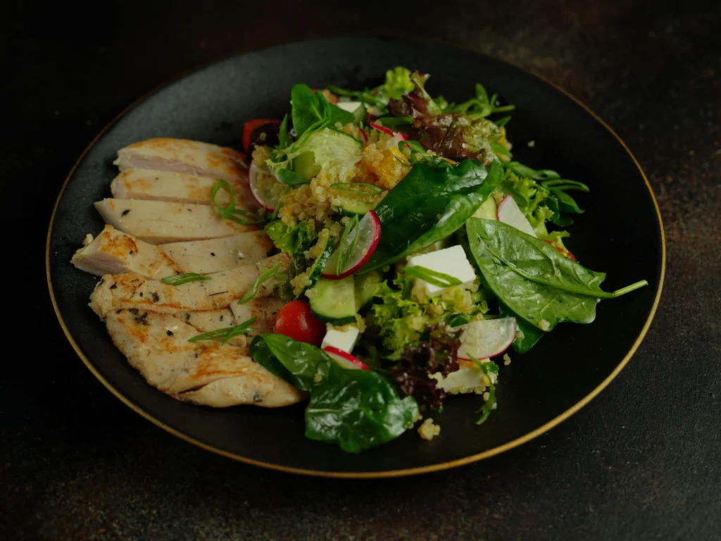 Finished Cobb Salad ready to serve, featuring a colorful array of vegetables and proteins with a homemade vinaigrette