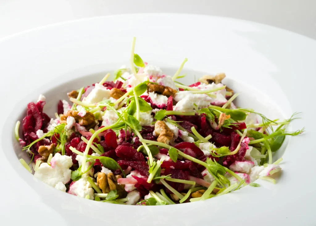 Close-Up Shot of Vegetable Tuna Salad Recipe on White Ceramic Plate