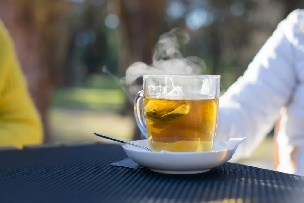 Close-up Shot of a Clear Cup with Ginger Tea