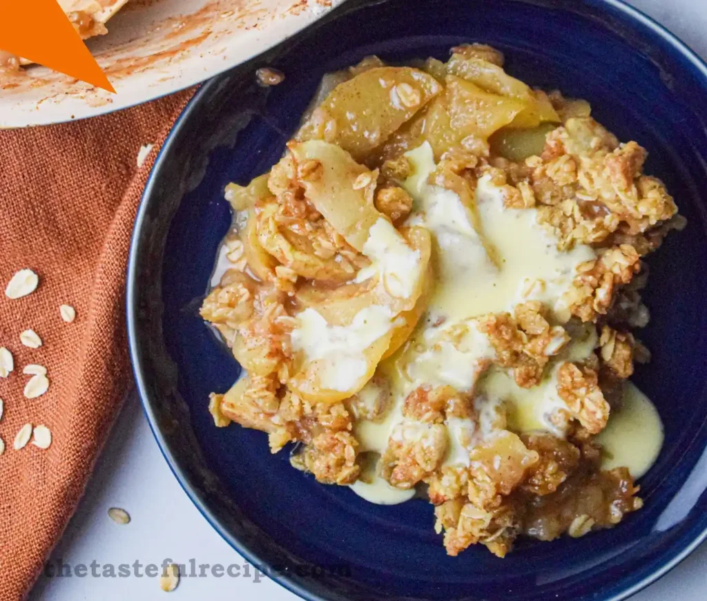 Freshly baked apple crumble in a dish with golden brown streusel topping