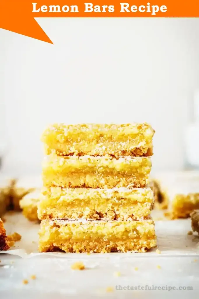 Close-up of a tangy lemon bar showing the smooth lemon filling and buttery shortbread crust