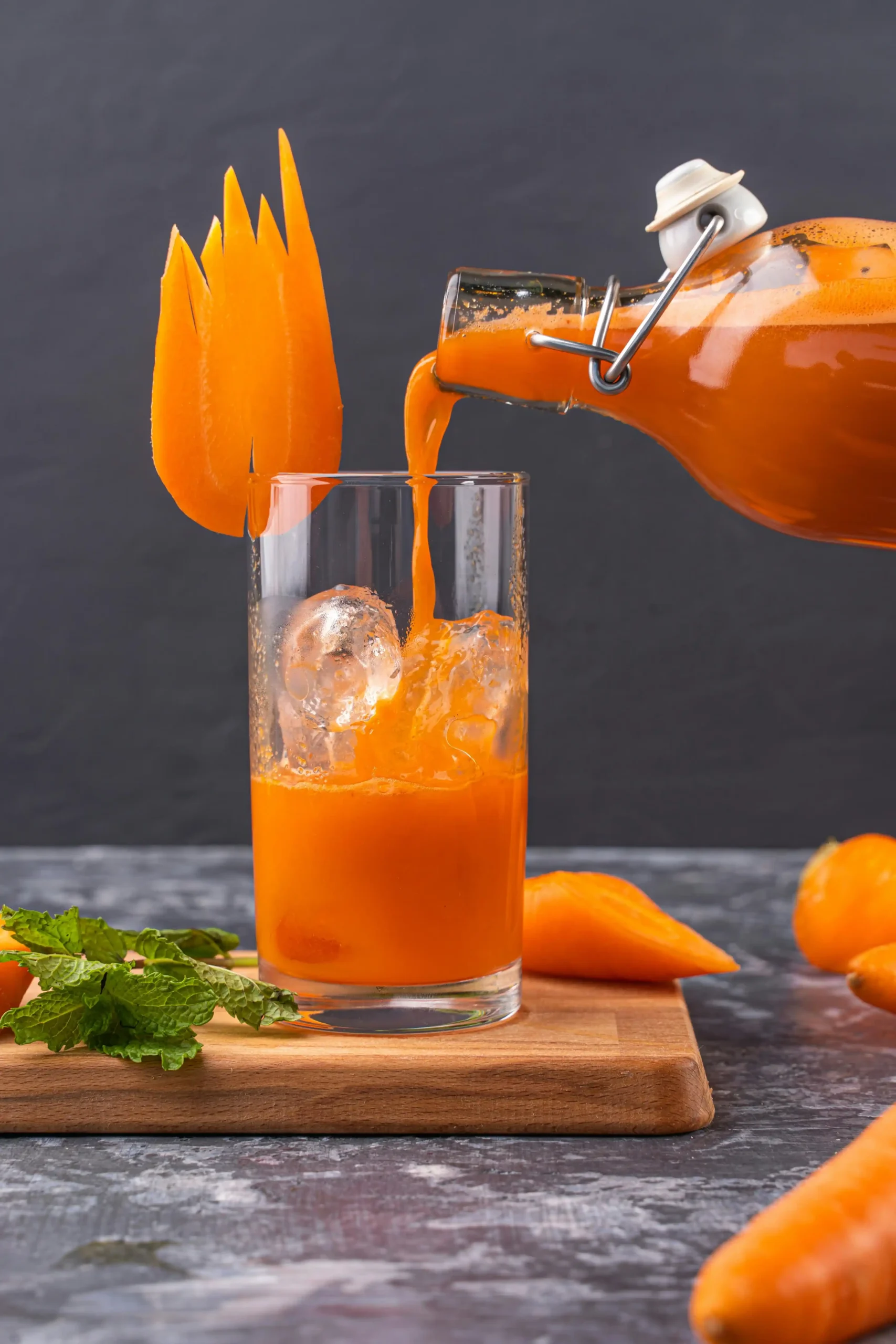 Pouring Carrot Juice Recipe in the Glass