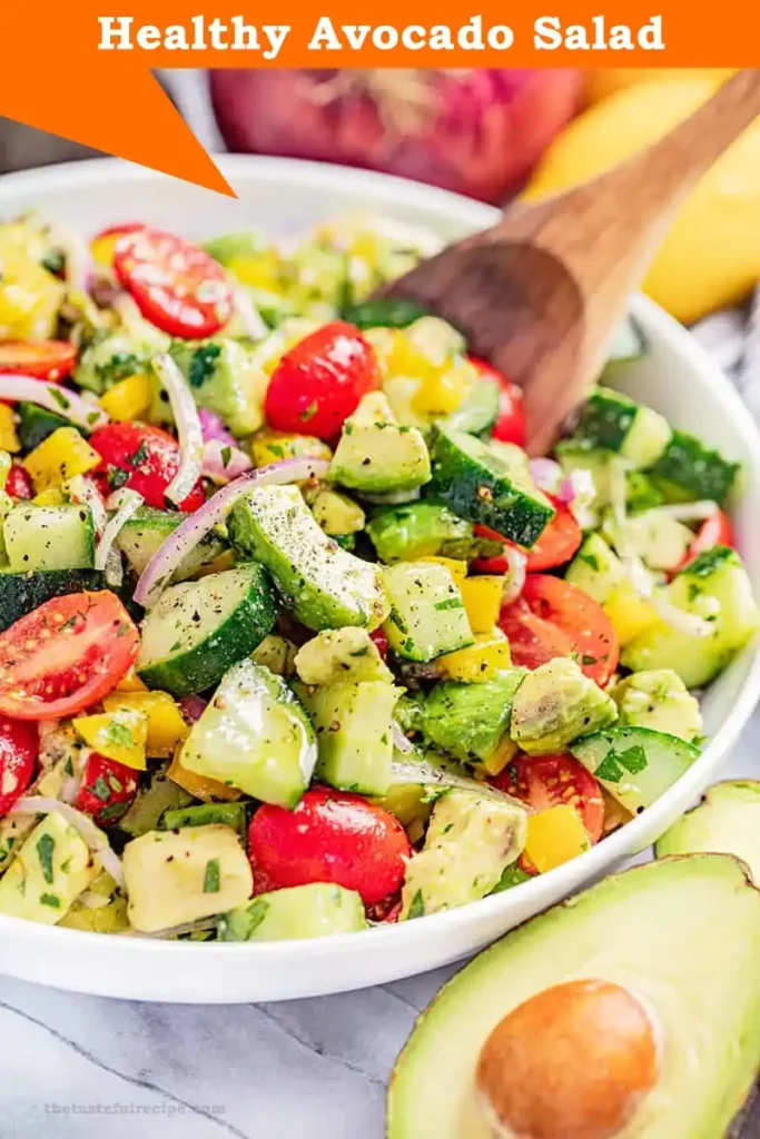 Refreshing avocado salad garnished with cilantro and lime