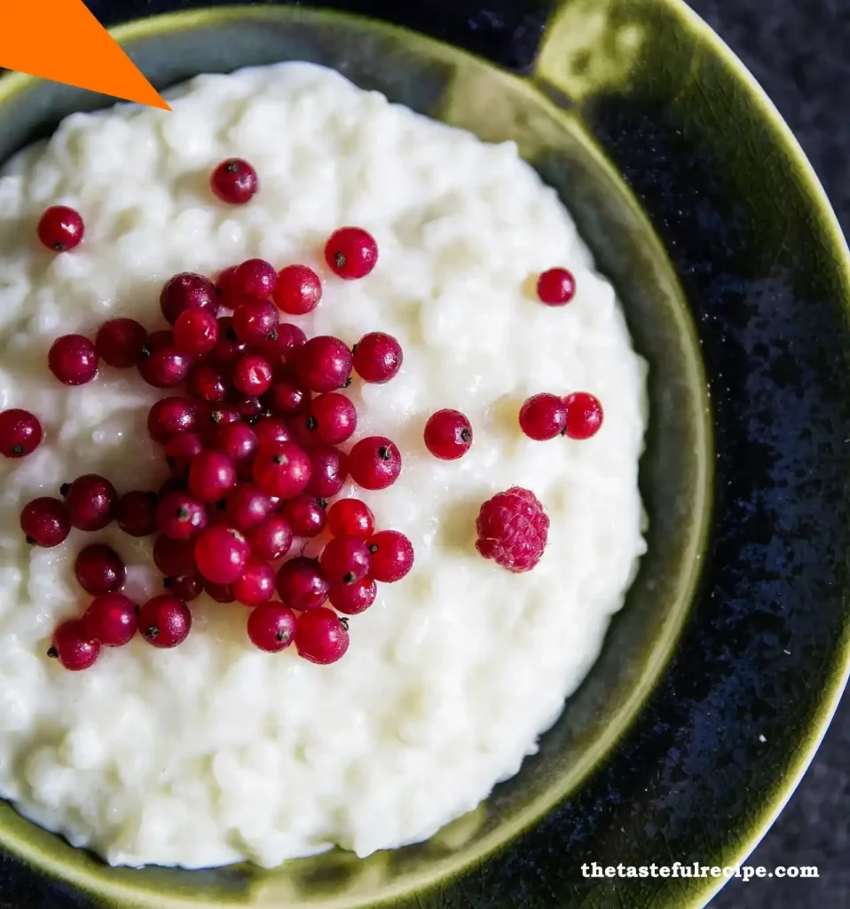 A serving of rice pudding topped with fresh strawberries and blueberries for added flavor