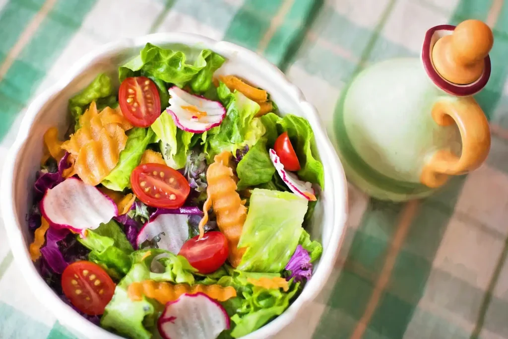 A plate of Mediterranean Salad with feta cheese and parsley garnished on top