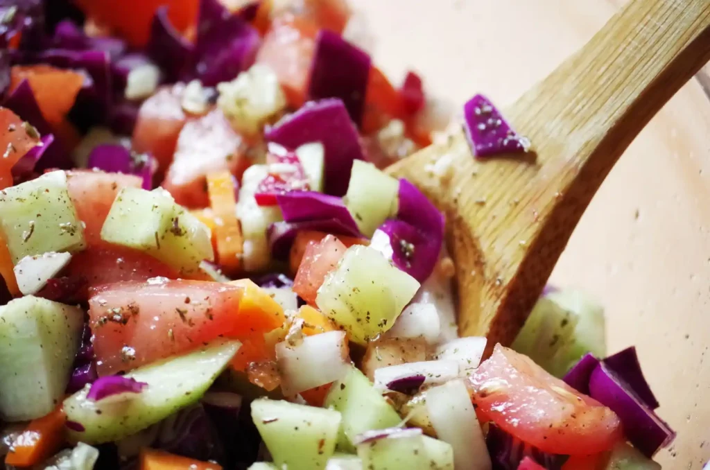 Mediterranean Salad with cherry tomatoes, cucumbers, red onions, and feta cheese