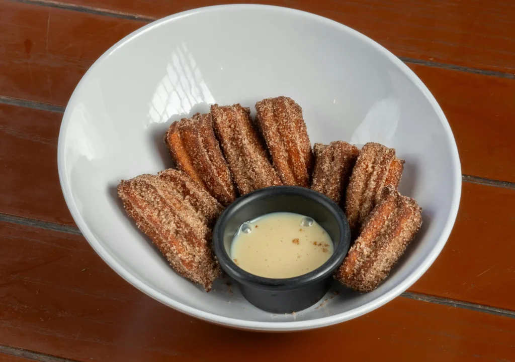 Delicious Mexican churros with Warm Dipping Sauce