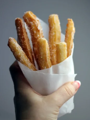 Homemade Mexican churros on a tray, ready to be served