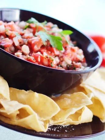 Close-up of homemade Pico de Gallo salsa served with tortilla chips