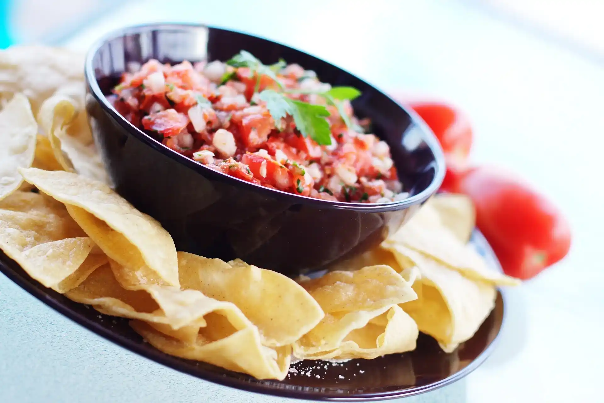 Close-up of homemade Pico de Gallo salsa served with tortilla chips